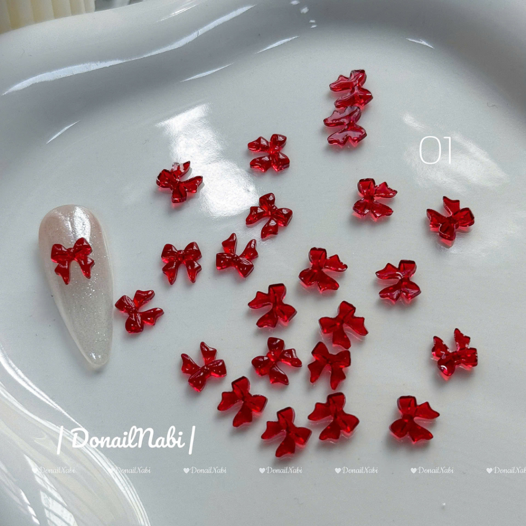 Set 50 charm đính móng  nơ nhựa đỏ