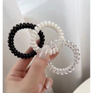 Cột tóc lò xo trong và đen cao cấp