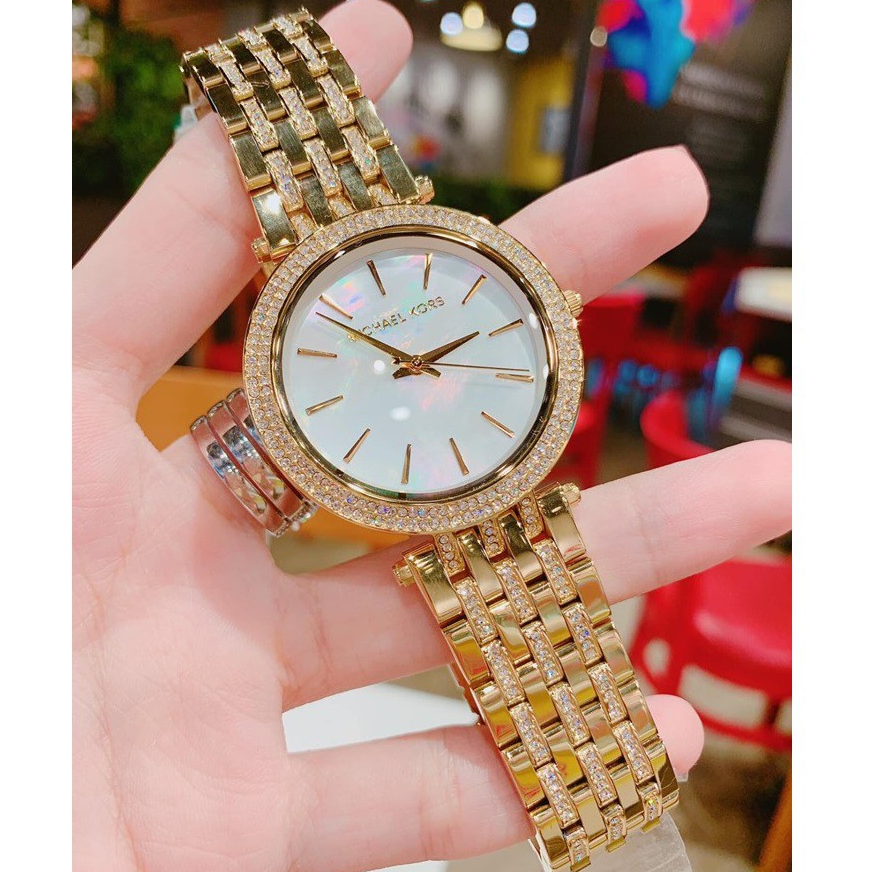 Đồng Hồ Nữ MK3219 Mặt Trắng Xà Cừ Viền Đá Kim Loại Mạ Vàng Máy Pin Size 39mm