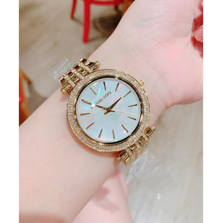 Đồng Hồ Nữ MK3219 Mặt Trắng Xà Cừ Viền Đá Kim Loại Mạ Vàng Máy Pin Size 39mm