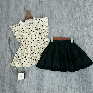 Set áo trái tim nền kem cánh tiên kèm chân váy bèo ren tầng 2 size SM của nữ