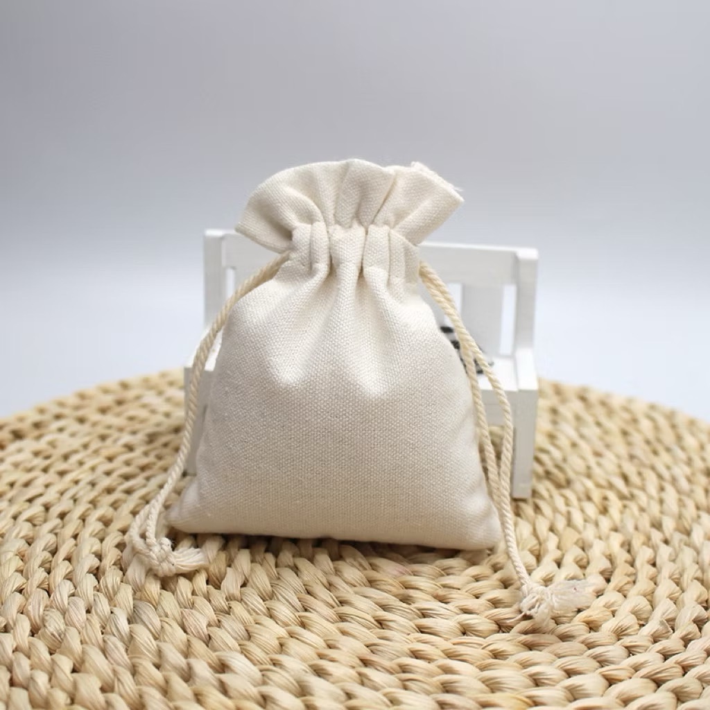 ￼Túi vải canvas,lót túi vải m có dây rút màu kem đậm đựng phụ kiện, cà phê, trang sức tiện lợi