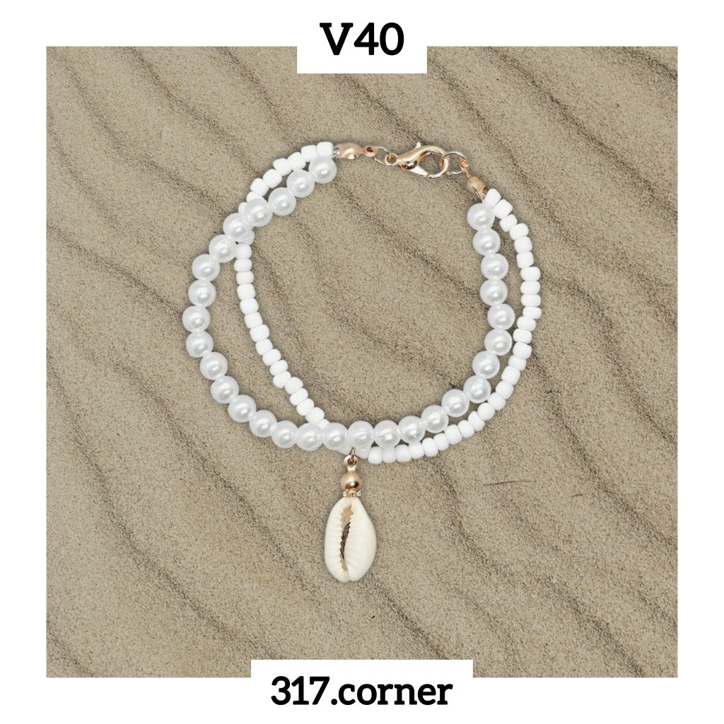 [Hàng đặt trước] Vòng tay hạt cườm charm vỏ sò - V40 - 317.corner