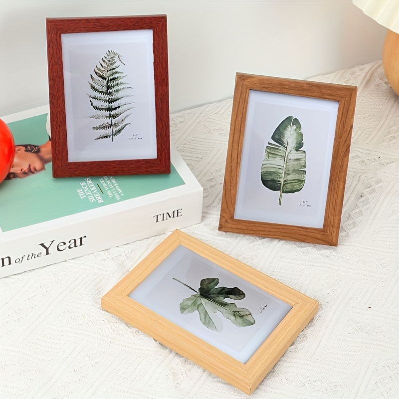 Khung ảnh BUNA kích thước 12x17cm và 14.5x19.6cm. Tặng kèm chân chống tiện lợi.