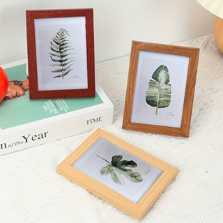 Khung ảnh BUNA kích thước 12x17cm và 14.5x19.6cm. Tặng kèm chân chống tiện lợi.