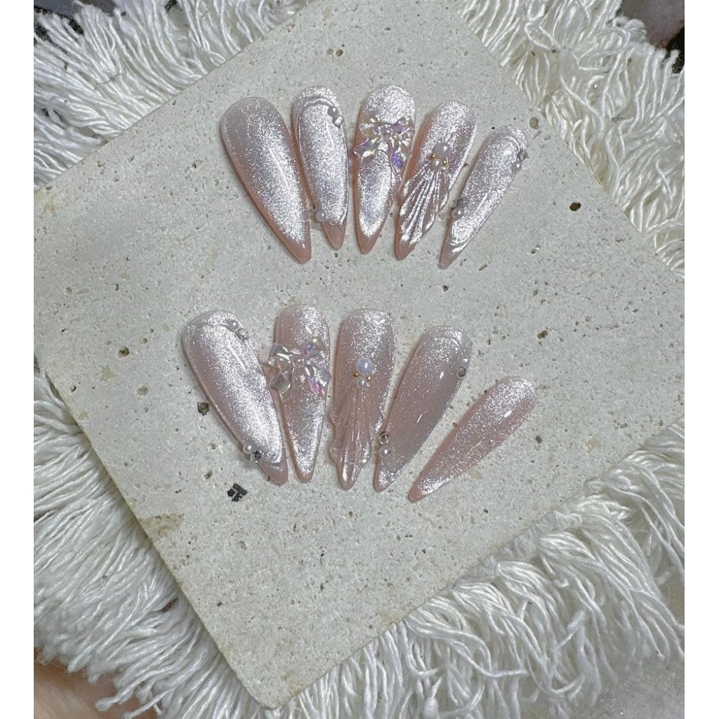 Nailbox E55 hồng nơ mắt mèo trang trí đá kèm keo dũa