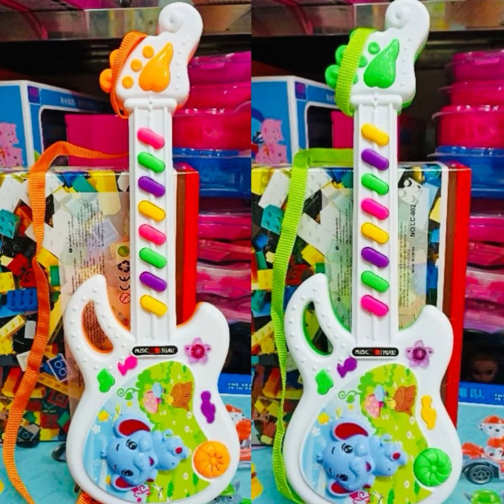 🎸 Đàn Guitar Đồ Chơi Cho Bé Có Nhạc – Guitar Mini Kèm Dây Đeo Chọn Màu Ngẫu Nhiên (Đàn guitar voi mi