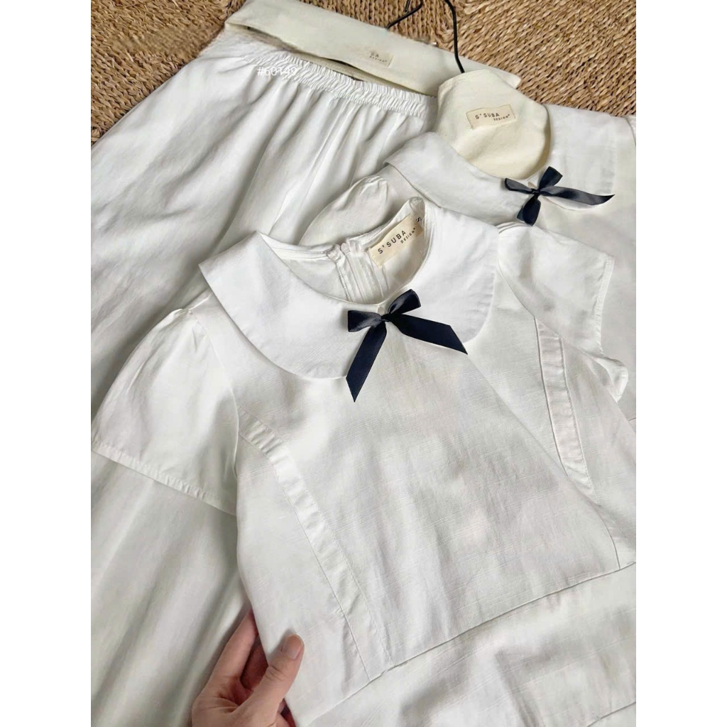 (Hàng Mới): Set Váy Áo Khoá Sau Tay Cộc Cổ Sen Đính Nơ Phối Tầng + Quần Suông Trắng Chất Thô-Ảnh Thật Lollaye | BigBuy360 - bigbuy360.vn