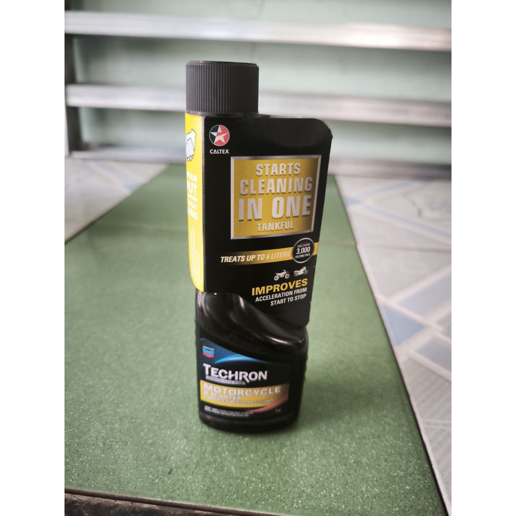 Dung dịch phụ gia làm sạch buồng đốt kim phun xe máy Caltex Techron Concentrate Plus 75ml 
