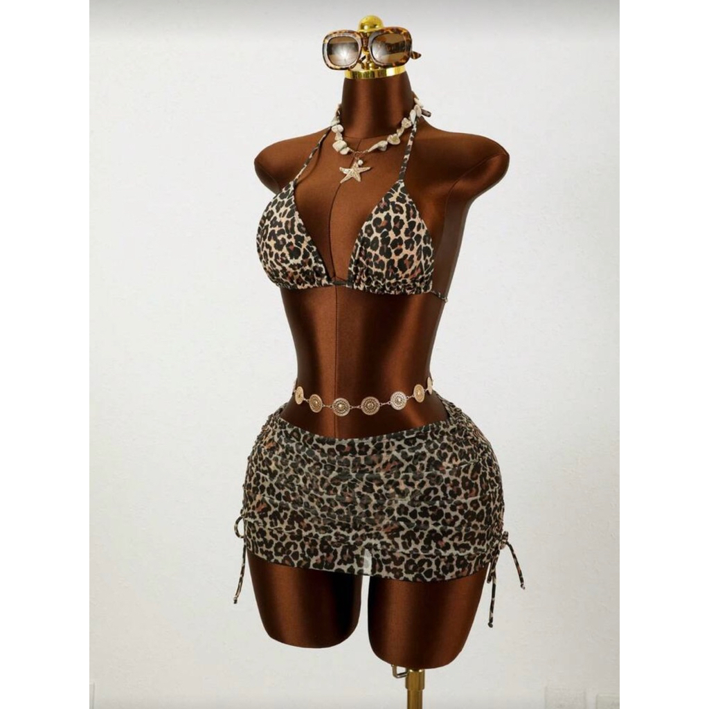 Bộ 3 món Zestiva dành cho nữ, gồm váy hai dây lưới họa tiết hoa và bikini. Bộ đồ bơi in họa tiết da