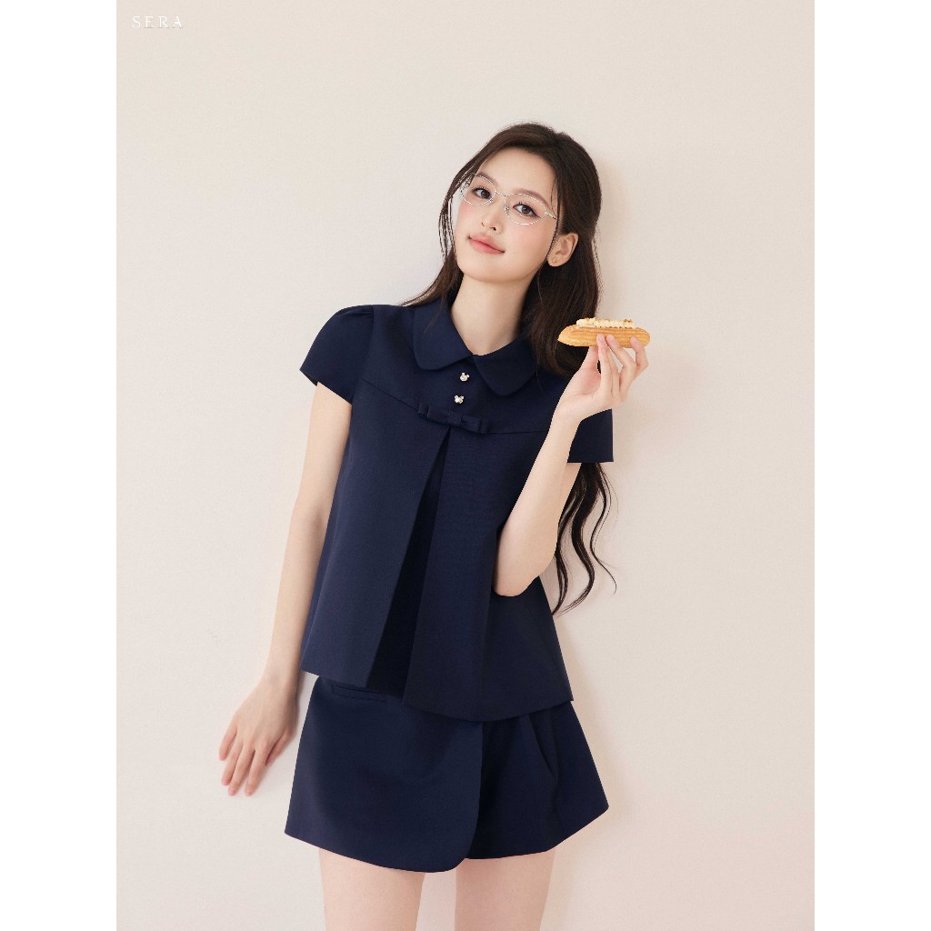 SERA - Set áo cổ sen tay hến đính nơ và quần giả váy xếp ly JIMMY | BigBuy360 - bigbuy360.vn