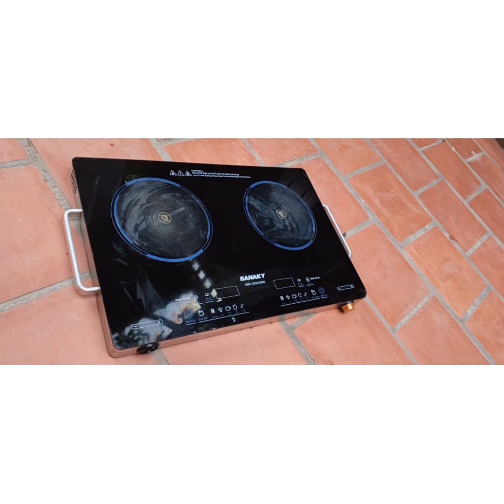 Mặt kính của bếp đôi hồng ngoại Sanaky SNK-203HGNW tháo bếp đã dùng