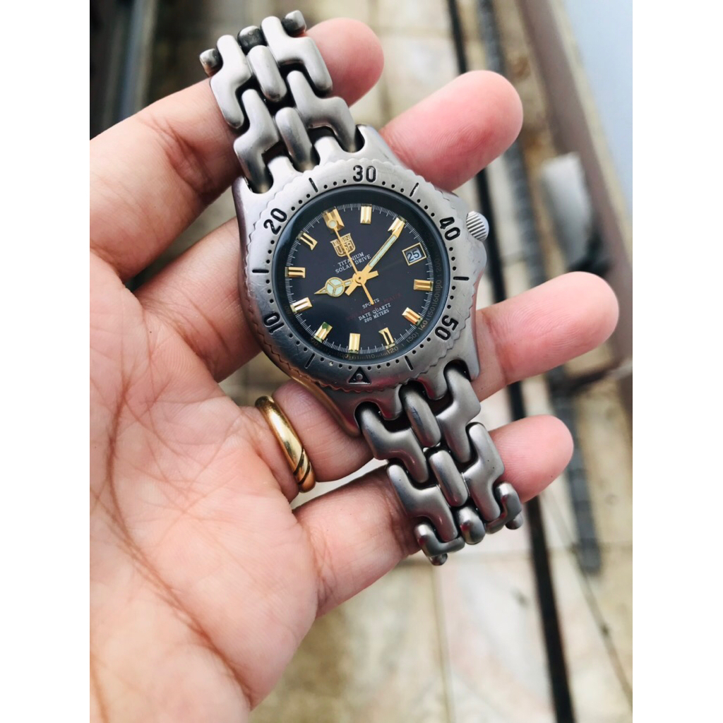 Đồng hồ nam si nhật Elgin USA titanium pin năng lượng size 37mm niềng xoay dây xương cá