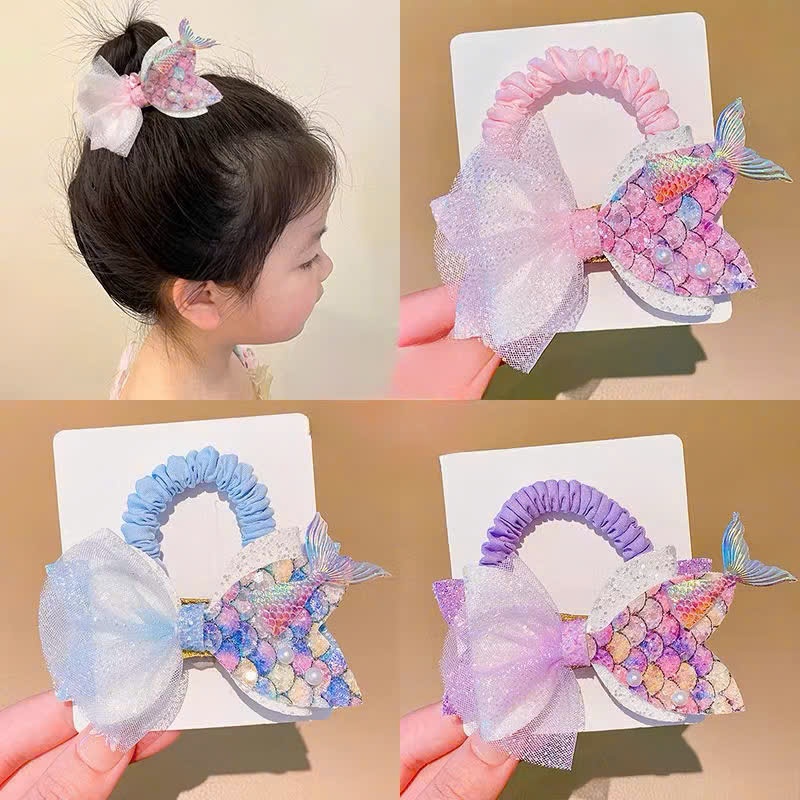 Cột tóc đuôi cá kim tuyến lấp lánh dễ thương cho bé đi biển đi chơi