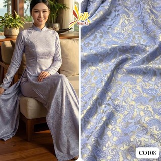 Lụa may áo dài-Nhaxasilk– hoa văn phượng vũ màu tím vàng – CO108