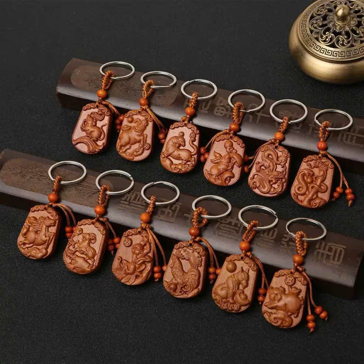Móc Khoá Gỗ Xoan Đào 12 Con Giáp, mặt sau ghi chữ Bình An (MK009)