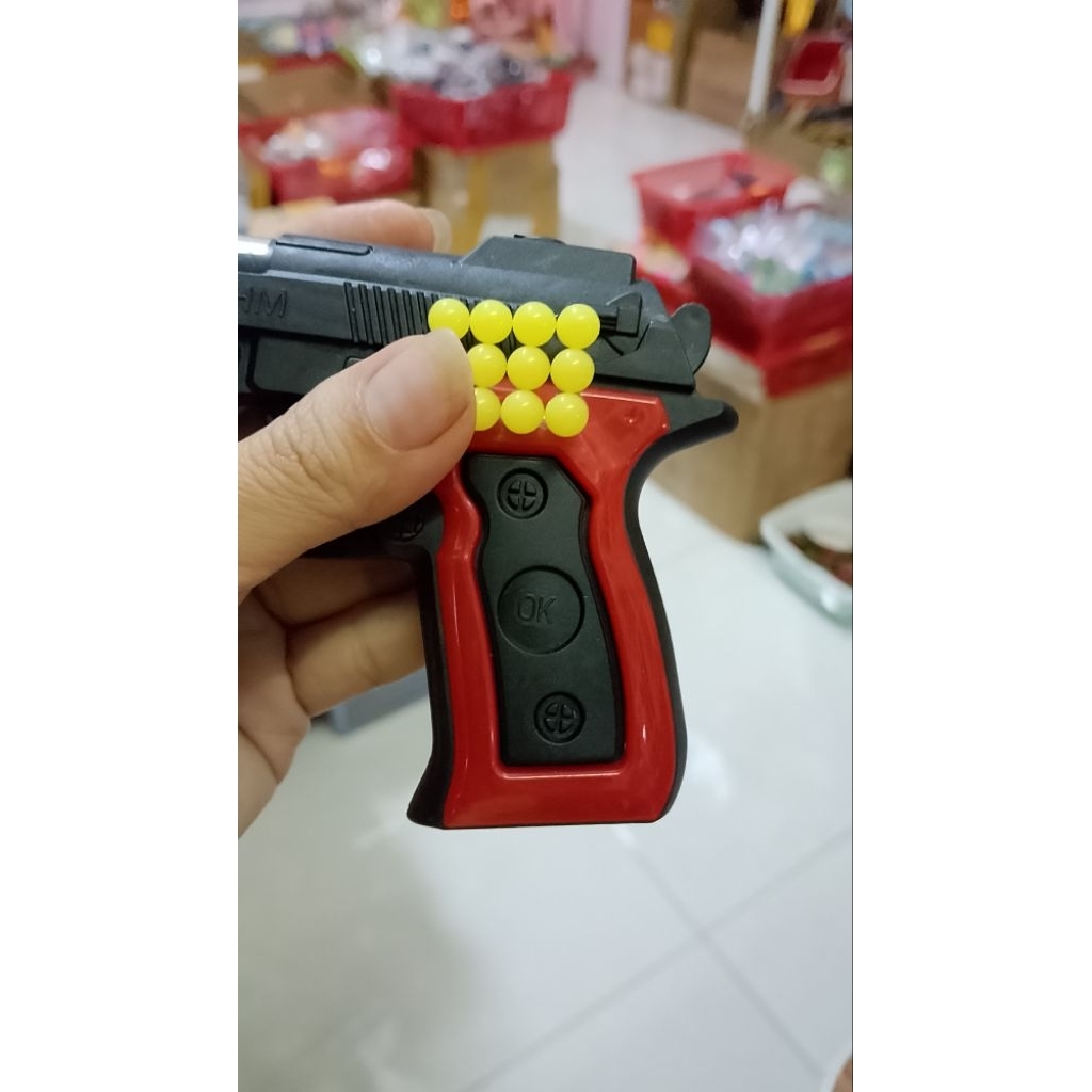 Mô hình nhựa đỏ đen,phát tiếng tách tách kèm bi nhựa 6mm.