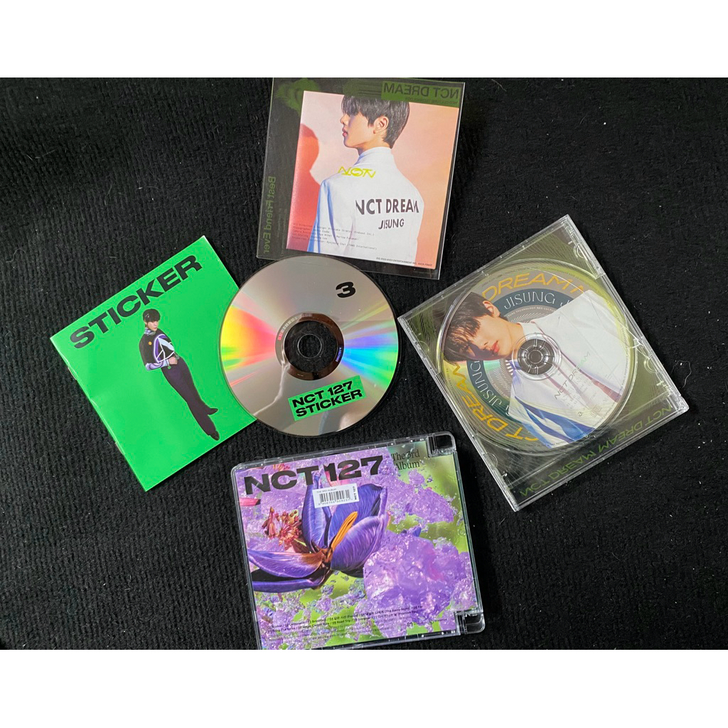 set 2 album Nct Dream Nct 127 mini album Sticker đã khui seal, gồm cd photobook đồ như hình.