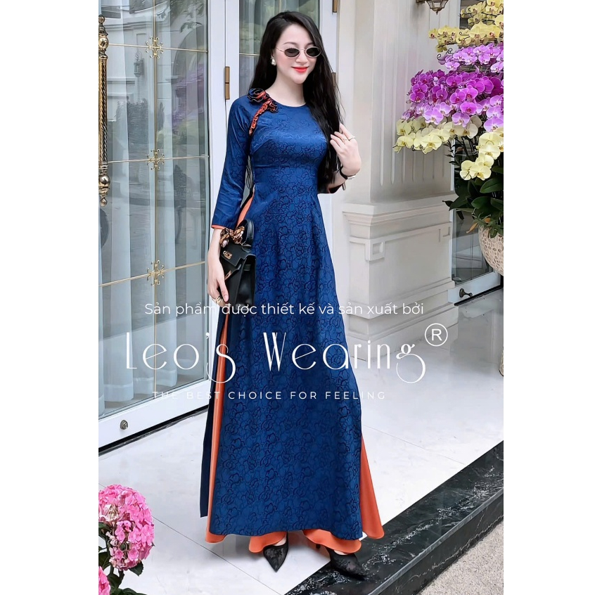 Áo dài gấm lụa LEOSWEARING cổ tròn đính hoa to, tay lửng xanh phối viền cam và Quần lụa cam DB104