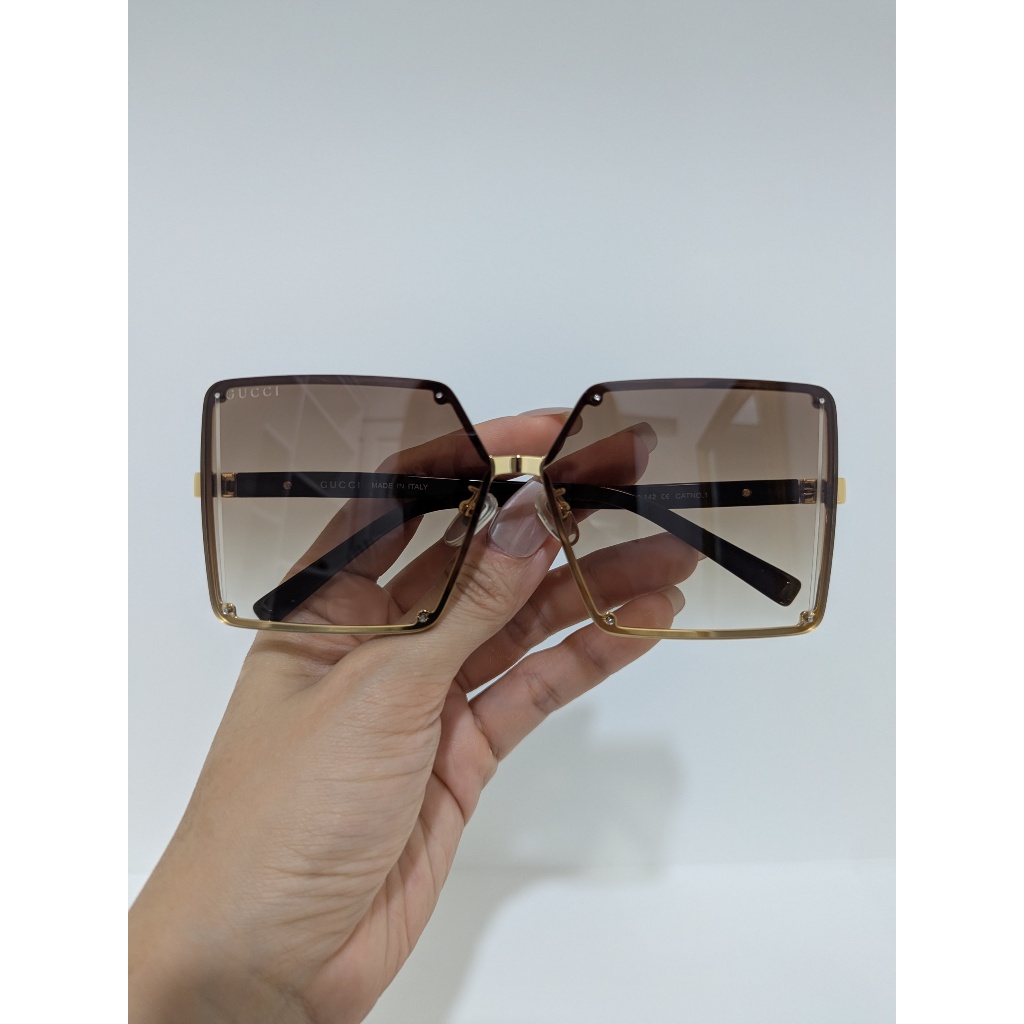 Kính mát si hiệu Âu tròng trà loang titan phối acetate mặt to
