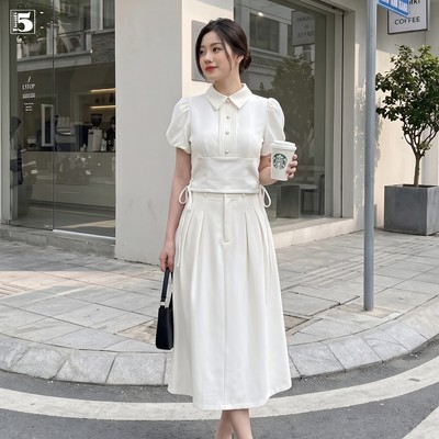 Set bộ Twentyfive gồm áo kiểu nhắn tay bồng, cổ đứng, thắt nơ 2 bên eo và Chân váy vải dáng dài SACM21