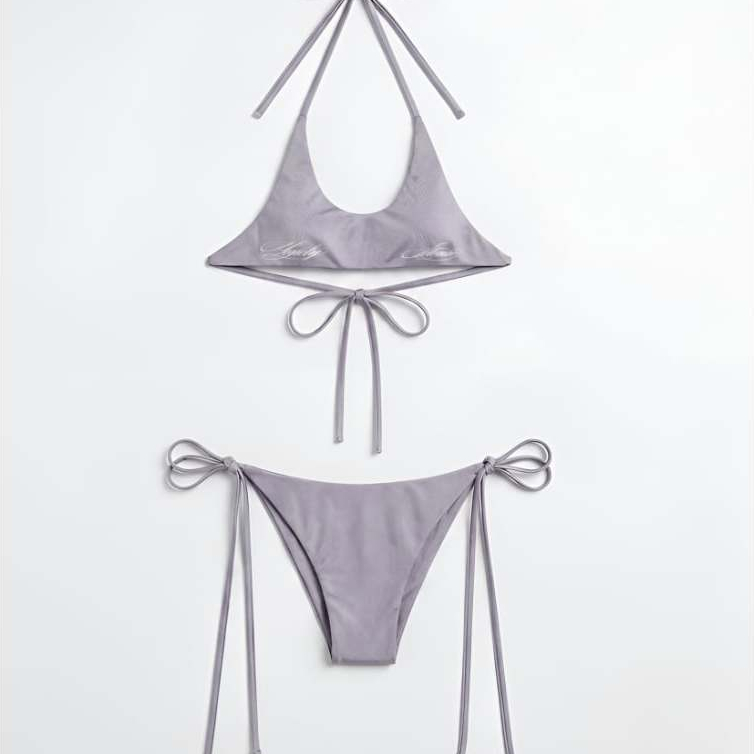 Set Bikini Lonely Stonie 2026 (Bra/Thong), chất liệu lụa thoáng mát, phối dây buộc, in hoạ tiết