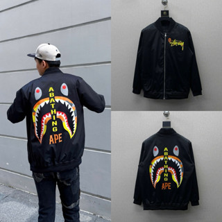 Áo khoác bomber gió nam nữ in hoạ tiết chữ kí hình miệng cá mập loang cam hai mặt boy phố 2025.