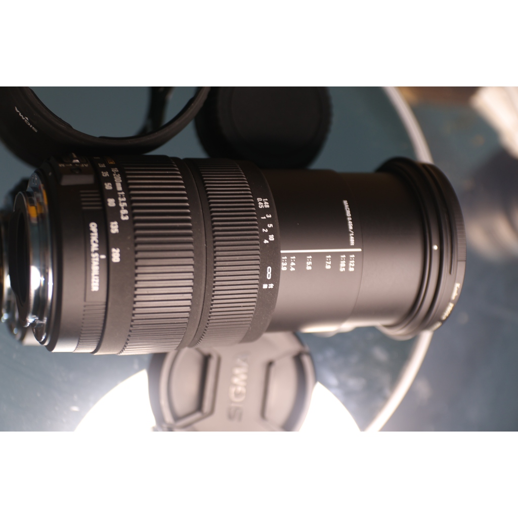 lens canon Sigma 18-200mm f/3.5-6.3 DC OS for Canon ef-s (Tình trạng kính 97% có 1 điểm mốc thấu kính lớn) - Ống kính Canon EF