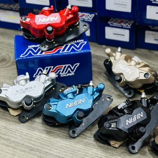 Heo dầu Nissin 2 piston Nissin Thái ( heo bên phải )