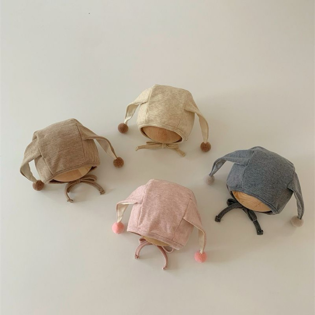 Mũ thu đông cotton 2 lớp buộc dây bảo vệ tai cho bé 2-10 tháng hình tai thỏ dài đính cục bông xinh x
