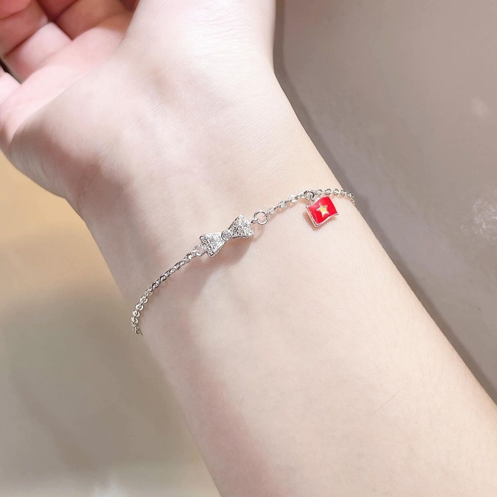 lắc tay nơ bạc treo cờ tổ quốc