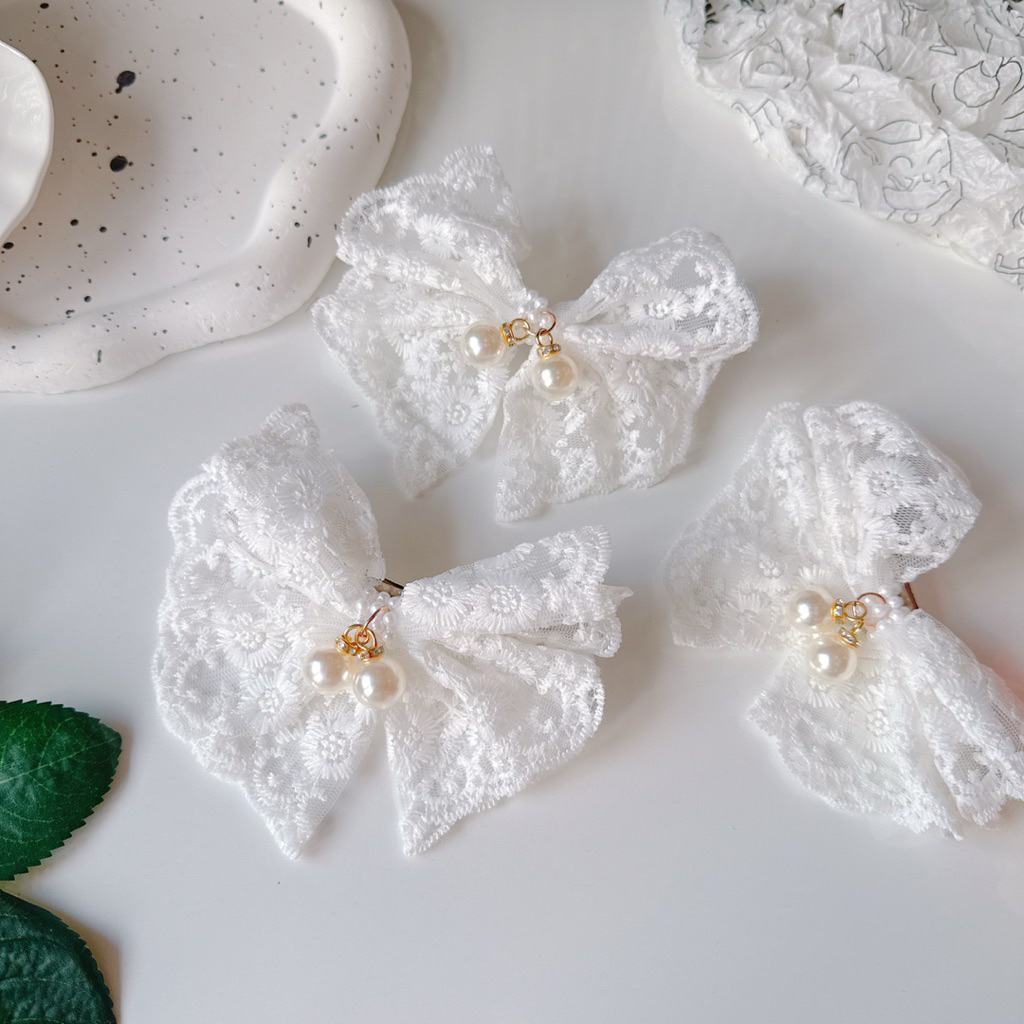 Kẹp tóc nơ ren trắng ngọc rơi tiểu thư