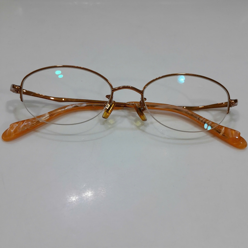 Gọng mắt kính nữ vàng đồng nữa viền second hand đã qua sử dụng