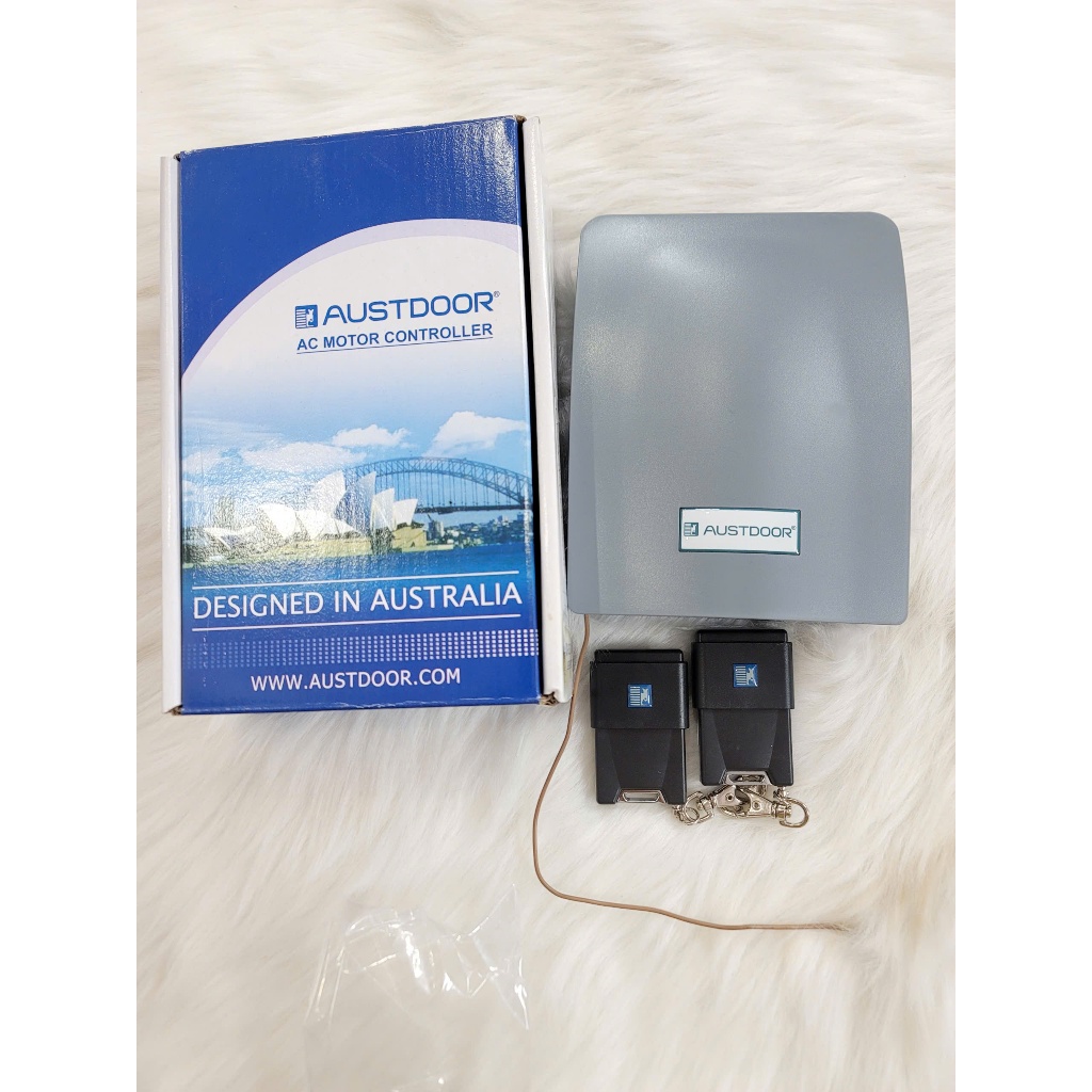 Bộ điều khiển cửa cuốn Austdoor  AA803.P màu xám gồm 2 Remote DK1 Chính hãng