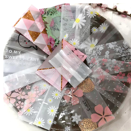 Set 100 túi bóng hàn nhiệt đựng trà hoa,bánh kẹo,  kích thước đa dạng nhiều họa tiết đẹp