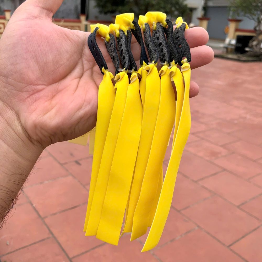 10 dây thun cao su Adam vàng trắng 0,65 – dài 15, kéo tới má