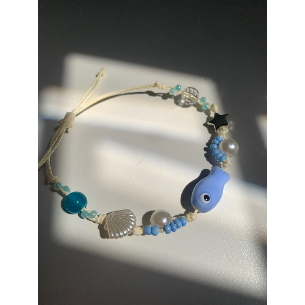 Vòng Tay Cá mắt quỷ Evil Eyes hoa biển