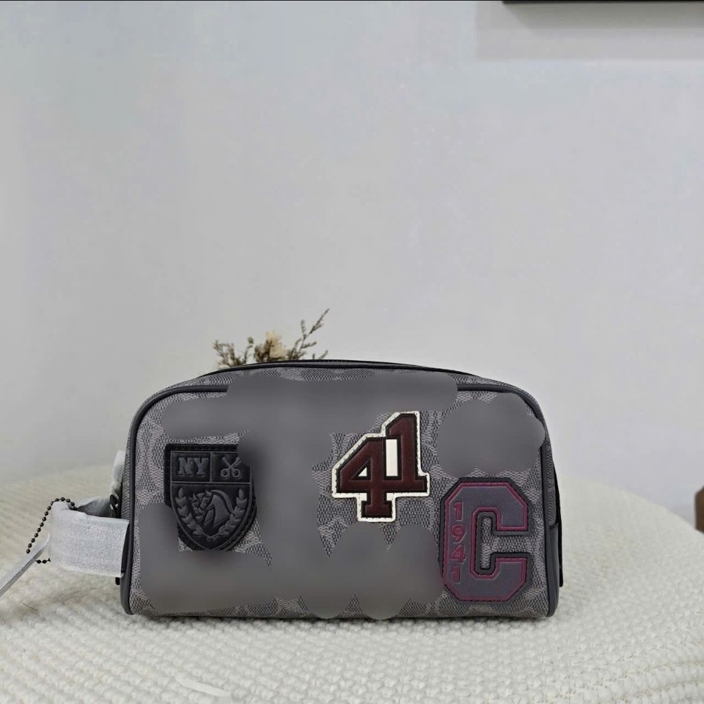 Túi nam cầm tay Large Travel Kit In Signature Canvas With Patches CCF36