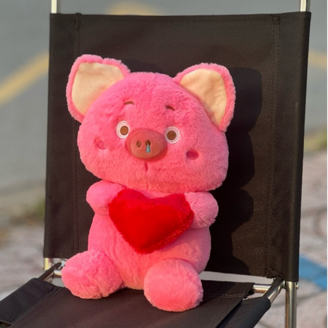 gấu bông thú nhồi bông heo ôm trái tim