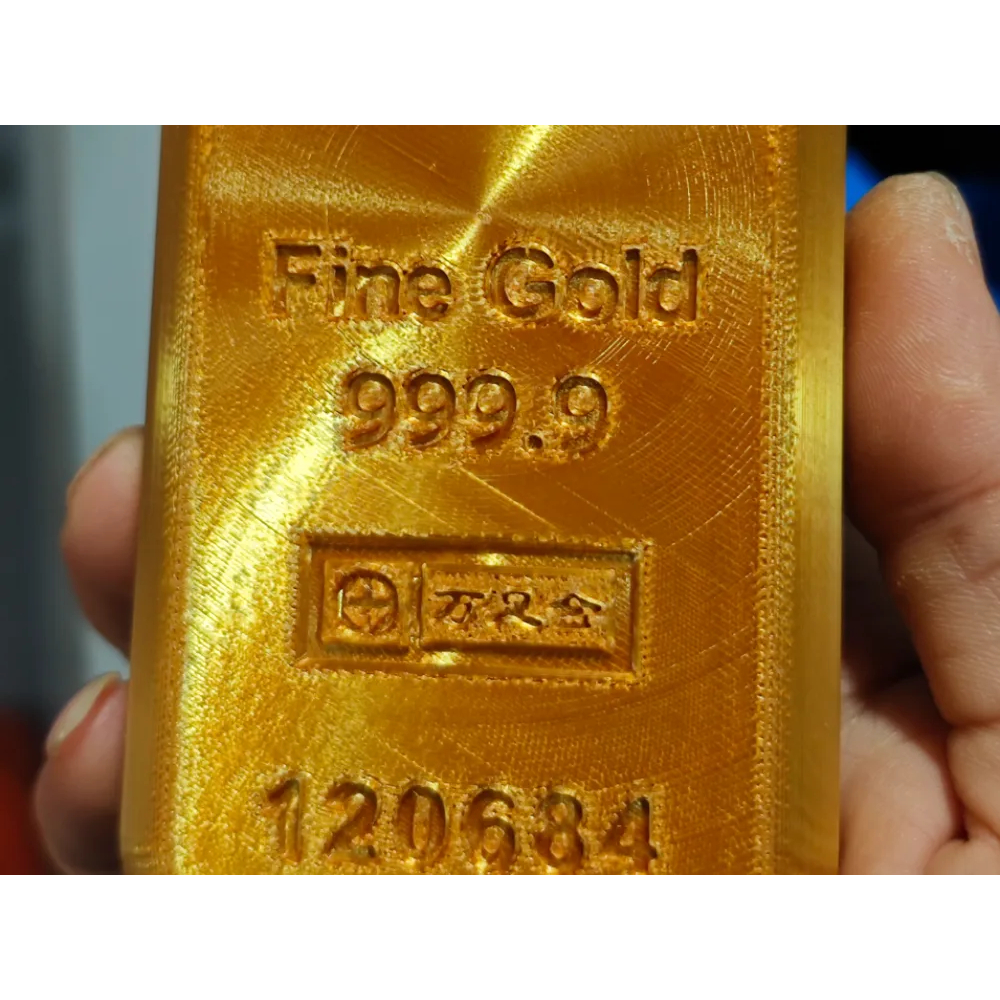 Mô hình cục vàng Delta Force  14,5x6,7 bằng nhựa màu vàng gold