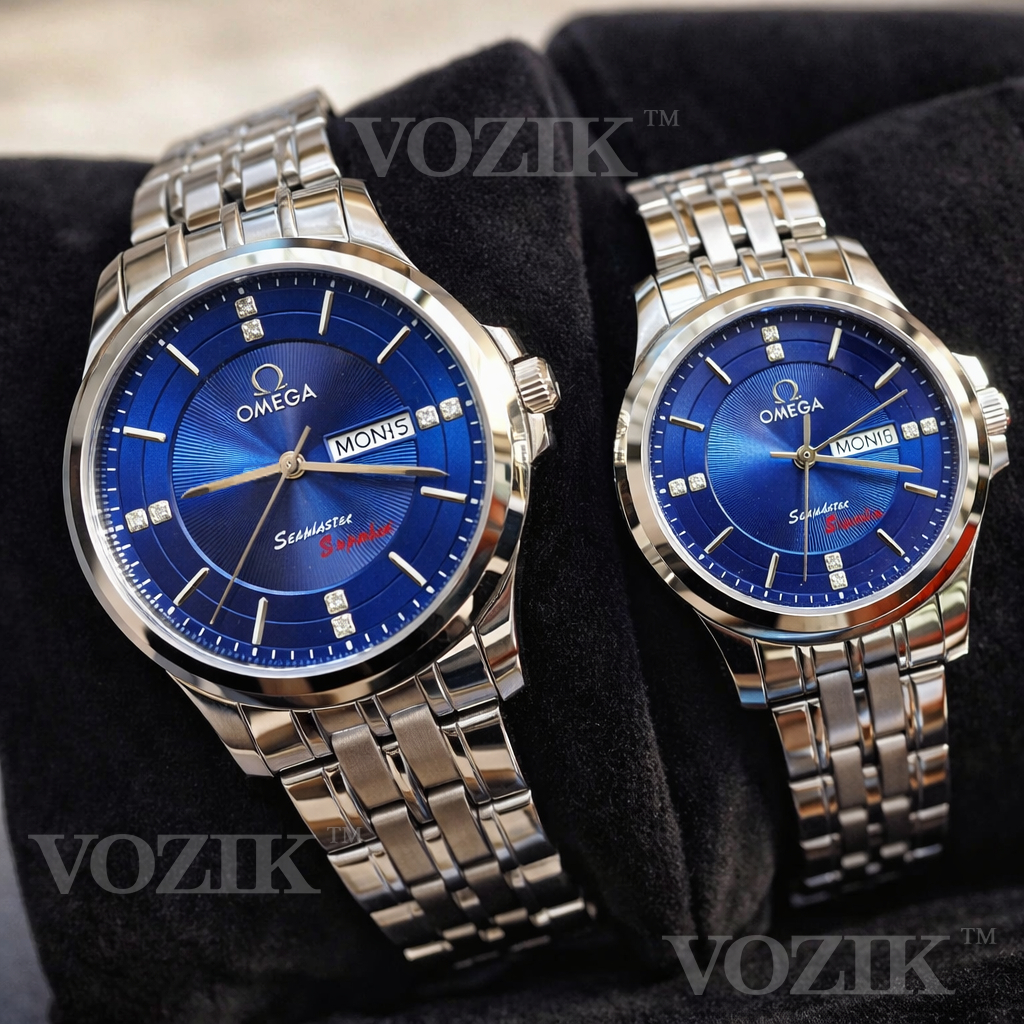 Đồng hồ cặp đôi OM 2 lịch máy pin chuẩn Nhật. Kính sapphire. Chống nước tốt. Mặt xanh, vỏ bạc