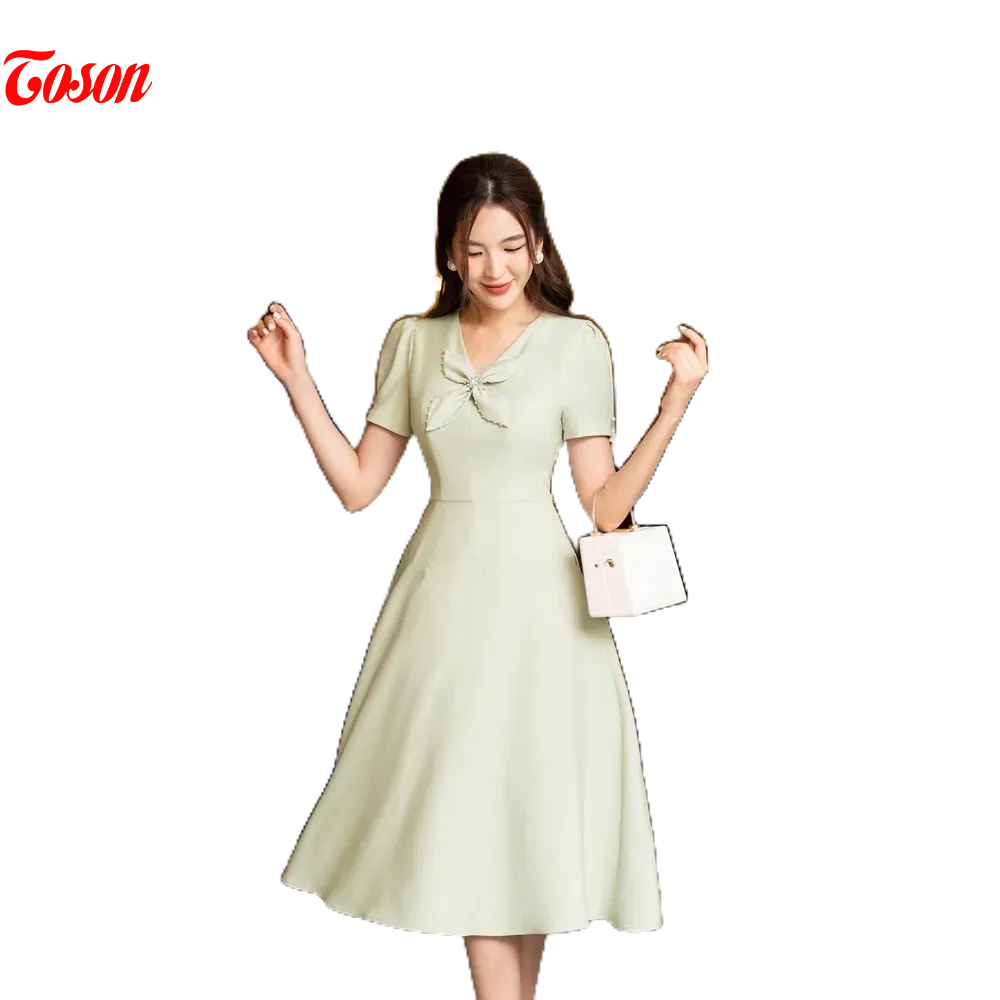 Đầm xanh cốm tuytsi xòe cắt múi cong, đính nơ cánh bướm Limitted Toson 49003X93