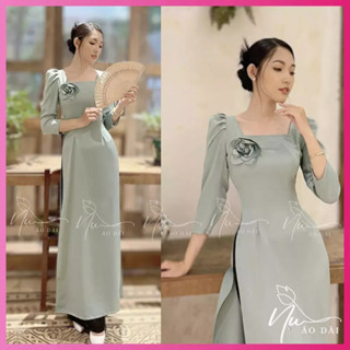 Áo dài nữ truyền thống tay bồng, chất lụa tằm ướt, cổ vuông gắn hoa thủ công ,màu xanh ngọc trẻ trung phù hợp nhiều dịp