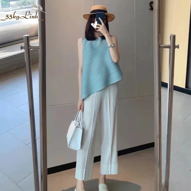 Áo nữ thun lò xo kiểu dáng vạt xéo sát nách, chất vải thun lò xo dập ly cao cấp - 55KG.LINH