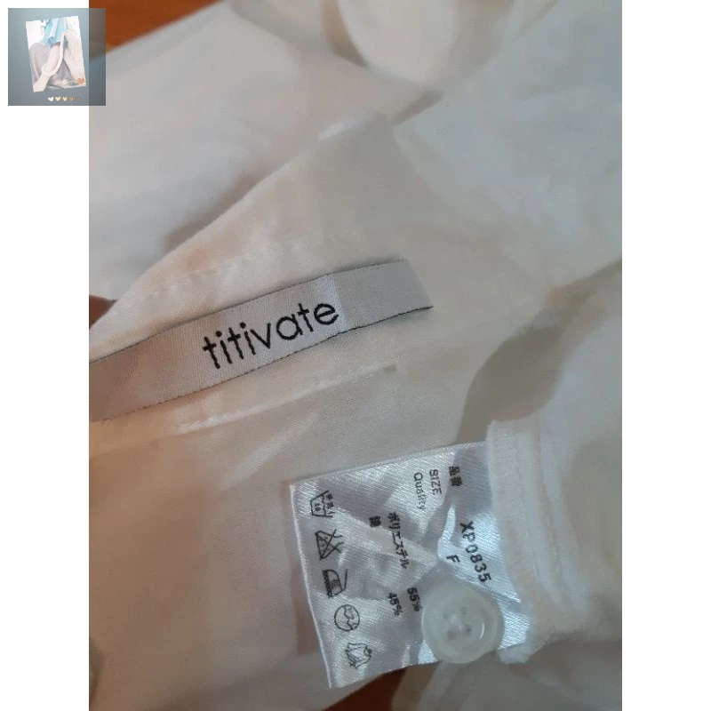 Áo sơmi trắng hiệu titivate phối gấu bèo