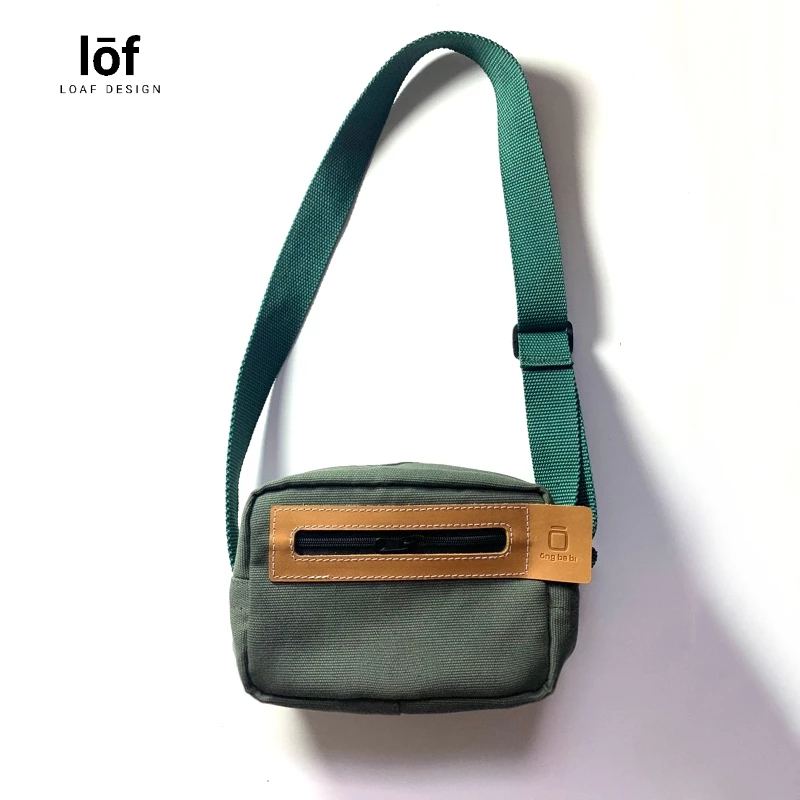 Túi đeo chéo canvas phối da Ông ba bị