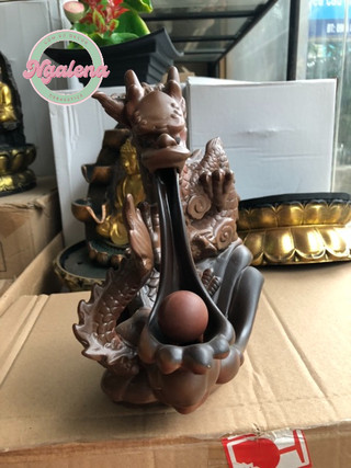 Thác khói trầm hương phi long phun châu