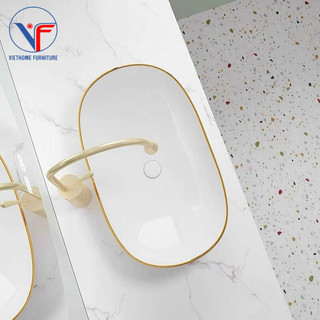 Lavabo thỏi trắng viền vàng có vân